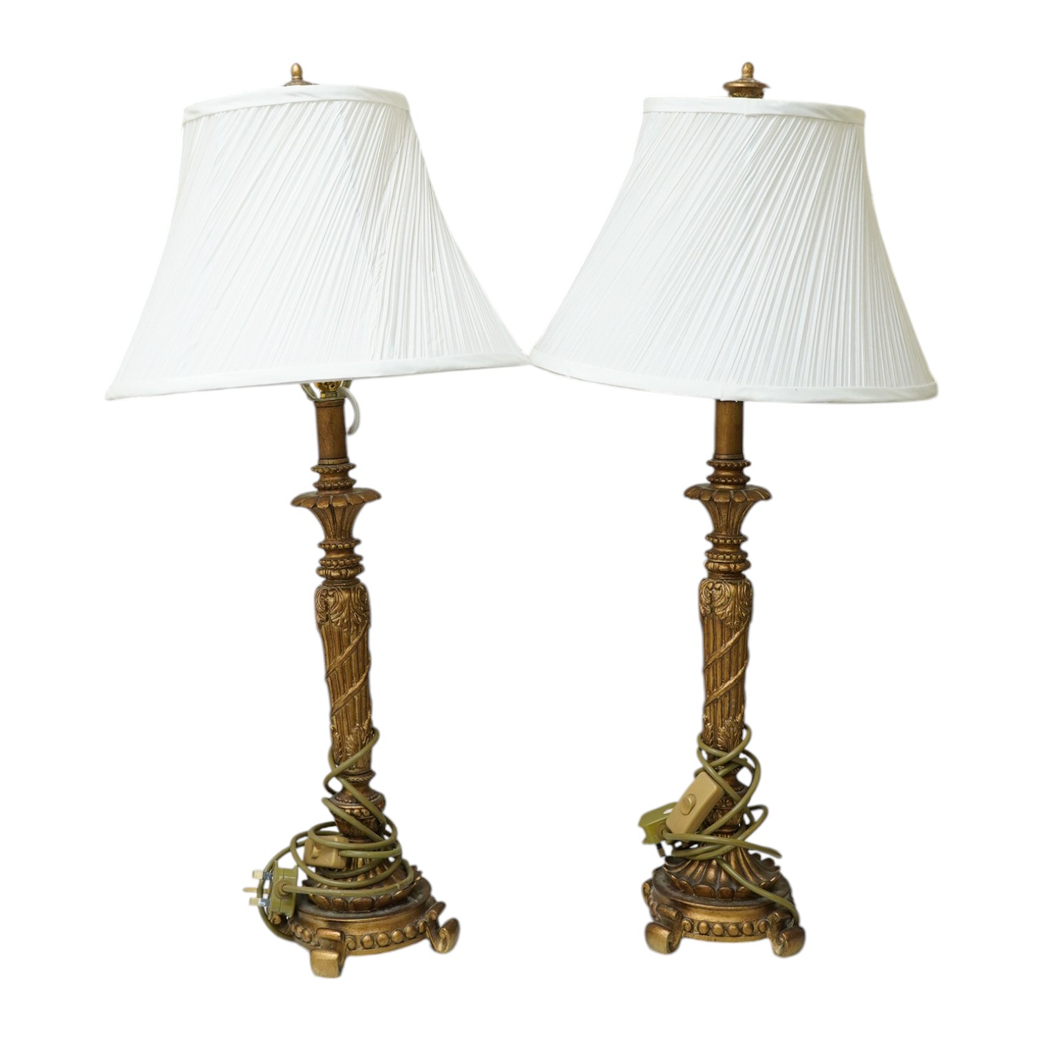 A pair of gilt resin table lamps with white shades, 76cm high. Condition - fair to good.